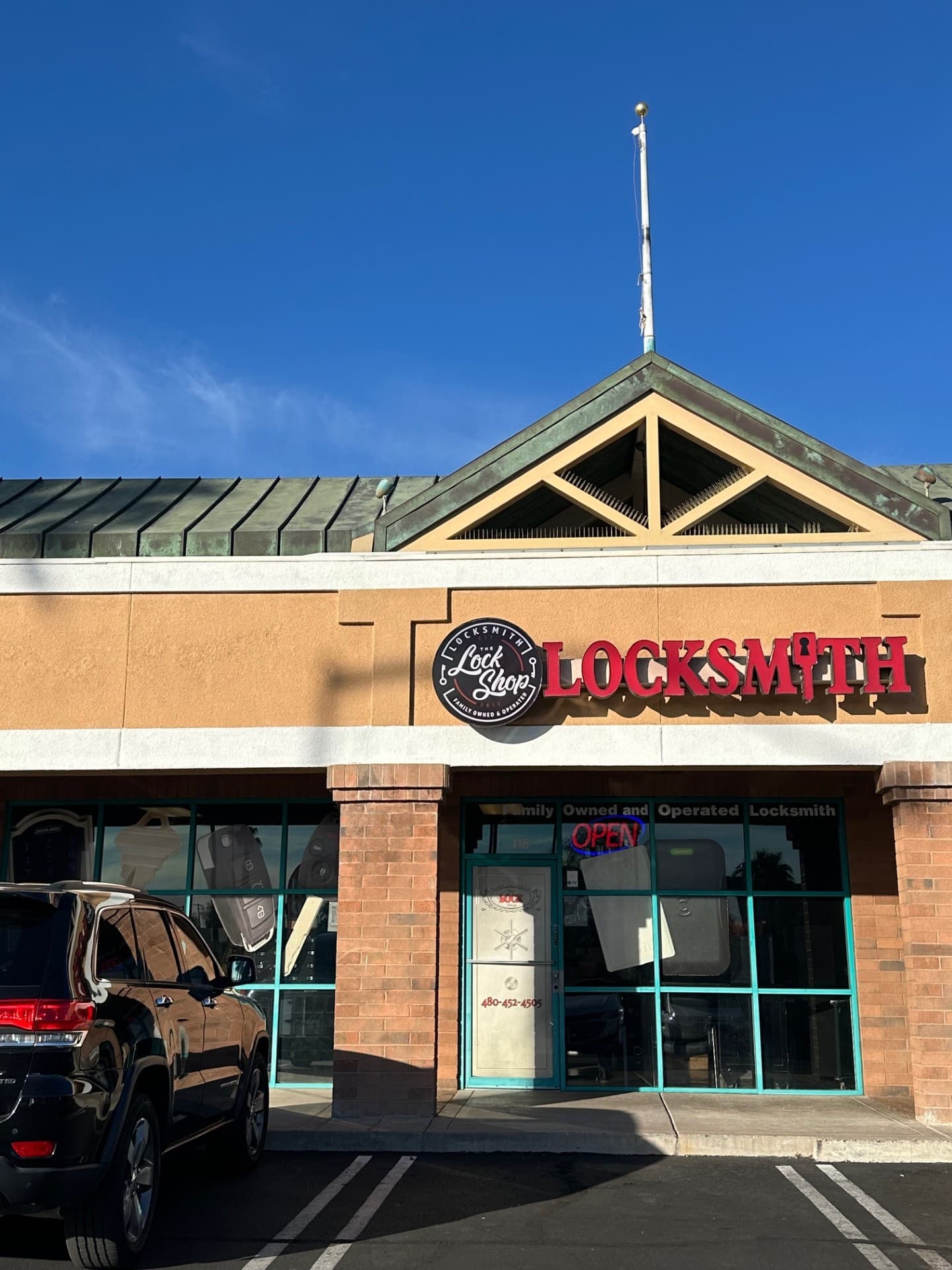 The LOCK Shop storefront at Power and Southern in Mesa with the red LOCKSMITH sign